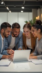 Obraz premium Diverse professional team brainstorming on laptop in modern bright office