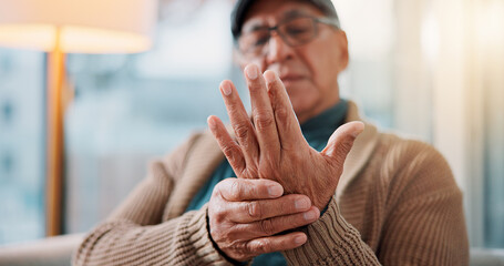 Hands, home and old man with wrist pain, arthritis and inflammation with fibromyalgia. Muscle...