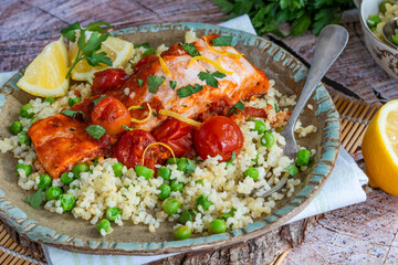 Harissa salmon with bulgur wheat, cherry tomatoes and green peas