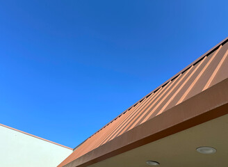 Commercial building roof and blue sky