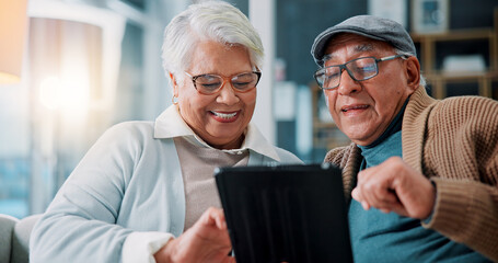 Senior couple, tablet and laugh on couch in home with meme, notification or funny video on web in...