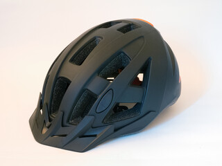 Fototapeta premium black bicycle helmet on white background