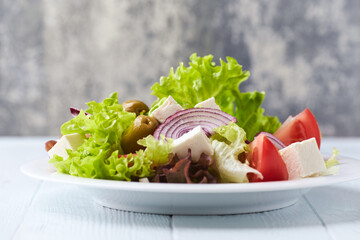Salad with feta cheese and tomatoes. Close up.	