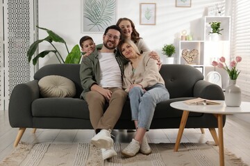 Obraz premium Portrait of happy parents with their kids at home