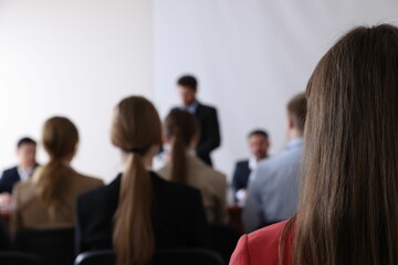 People having business training in conference room, selective focus