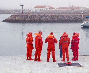 A group of submariners are preparing to dive. Instructing the dive team during the operation....