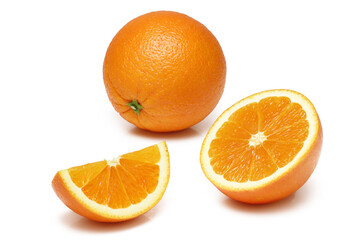 Oranges whole and sliced on white background