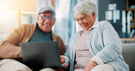 Senior couple, laptop and laugh on sofa in home with meme, streaming and happy with funny film in...
