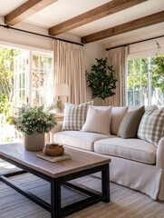 Cozy living room with a white sofa and decorative pillows, sunlight streaming through windows
