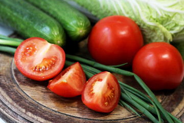 Fresh tomatoes and cucumbers for salad. Vegetables.