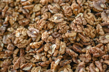 Walnut kernels for sale in market. Close up of walnuts. Bazaar. Dried walnuts closeup.