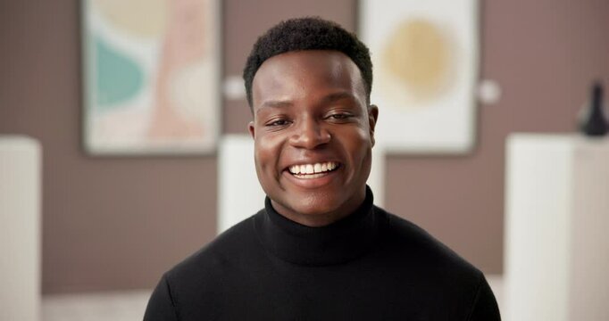 Art gallery, curator and face of happy black man with confidence, culture and creative business. Exhibition critic, sales agent or artist at presentation, auction or painting showroom with smile