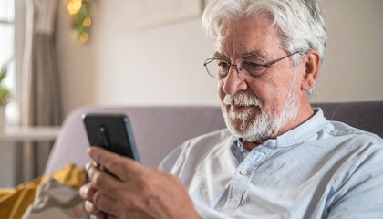 Elderly Man using a Smartphone - Elders using Technology - Adapting to Advanced Society - Old Man texting, chatting, calling, surfing - Senior using a mobile phone or cellphone at Home