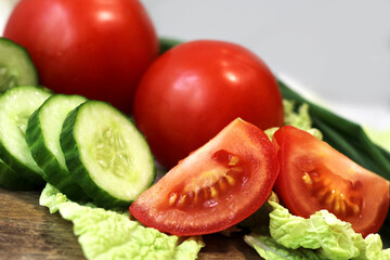 Fresh tomatoes and cucumbers for salad. Vegetables.