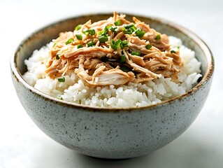 Rice Bowl Topped with Shredded Chicken and Fresh Green Onions, White Background