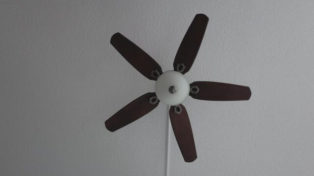 Celling fan slow spining heavy wooden fins front look
