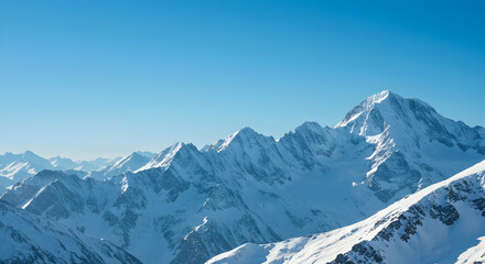 Fototapeta premium Majestic Snow-Capped Mountains Under Clear Blue Sky in Winter