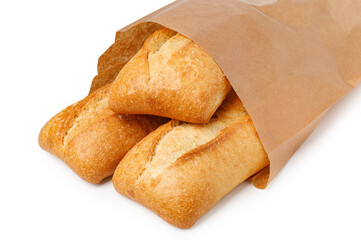 Crusty bread loaves emerging from paper bag on white background