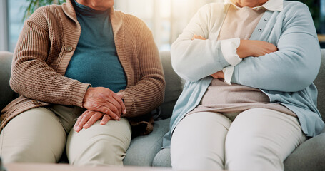 Home, hands and senior couple with conflict in marriage, argument and disagreement in living room. Sofa, elderly man and old woman with body language for toxic relationship, breakup and fighting © peopleimages.com