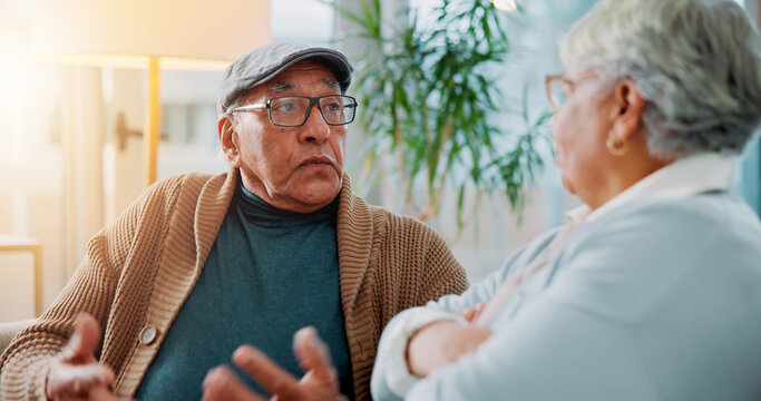 Senior couple, fighting and sofa at house for argument, divorce conflict and partner disagreement. Elderly people, communication problem and blame for separation, marriage crisis and betrayal drama