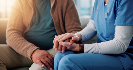 Home, caregiver and senior person with holding hands for support, empathy and console after...