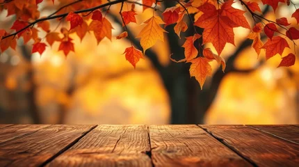 Gardinen Autumnal scene with vibrant red and orange leaves overhanging a rustic wooden surface, blurred fall foliage backdrop © Hasriani