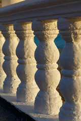 Fototapeta premium The white pillars are part of a stone railing