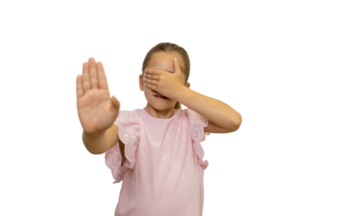 Little girl showing stop sign and covering eyes on transparent background