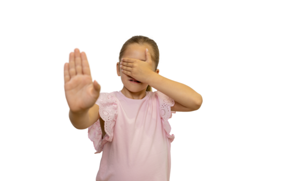 Little girl showing stop sign and covering eyes on transparent background
