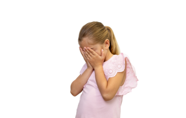 Sad little girl crying and covering her face with hands on transparent background