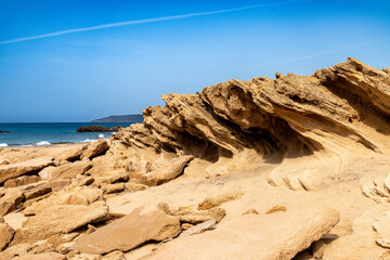 Wind-Carved Sandstone Formations at Portu Maga Beach