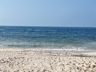 Water waves Sea Shore Beautiful Panorama white sand beach and turquoise water View.
Holiday summer beach background, Wave of sea on White sandy beach. Enjoy Holiday on Public Beach Heavy Water Waves