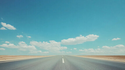 An endless road leads towards the horizon under a clear blue sky, inviting travel and exploration.
