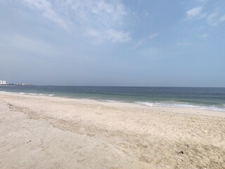 Water waves Sea Shore Beautiful Panorama white sand beach and turquoise water View.
Holiday summer beach background, Wave of sea on White sandy beach. Enjoy Holiday on Public Beach Heavy Water Waves