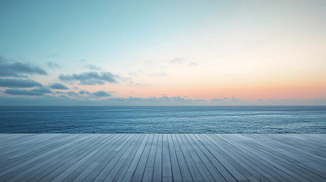A calm ocean at dusk with wooden deck in foreground, showcasing a beautiful sunset view.
