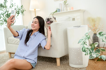 Woman Taking a Selfie With Her Dog at Home During a Sunny Afternoon