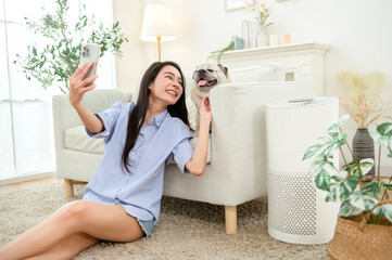 Woman Taking a Selfie With Her Dog at Home During a Sunny Afternoon