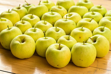green apples on a wooden table