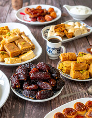 A spread of traditional Emirati food, including dates, Arabic coffee (gahwa), and local sweets, representing the hospitality and culinary customs.