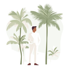 Groom in white suit standing among tropical palm trees

