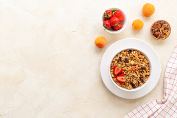 Bowl with oatmeal granola and ingredients - apricots and strawberry. Top view