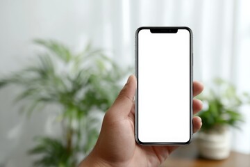 Person holding a smartphone with a blank screen.