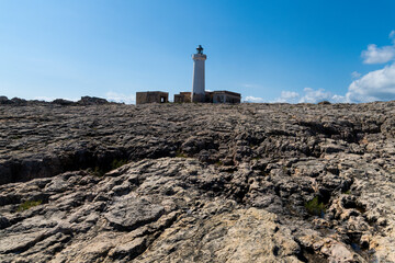 Lighthouse on wide rocky terrain near Syracuse
