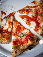 Delicious slices of pizza topped with cheese and sauce on a plate showcasing culinary delight concept. copy space