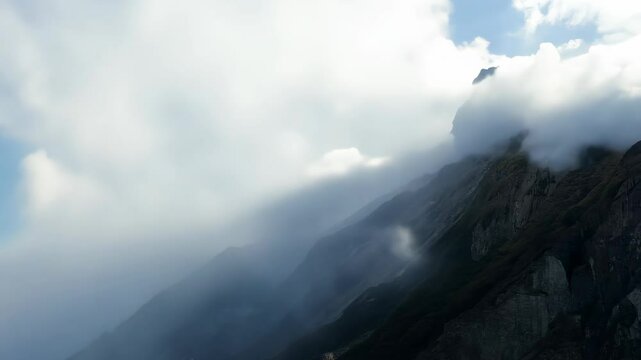 Clouds Cascading Over Mountain Peak &ndash; Closeup Surreal Ethereal Cloud Flow