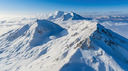Snowy mountain peaks above clouds