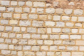 Stone wall with uniform rectangular blocks