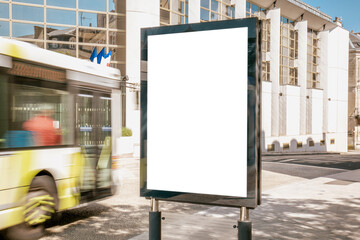 Blank billboard in front of modern glass building - mockup