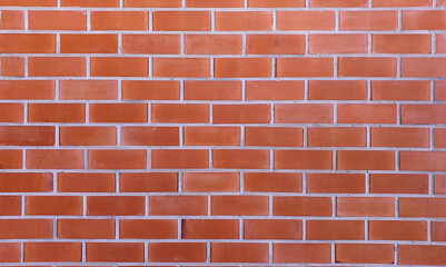Beautiful smooth red brick wallpaper background. Cement wall arranged in clean layers.