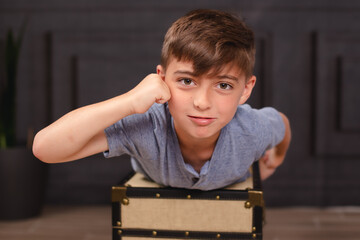 kid playing superman on a house setting 
